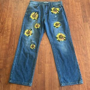 Mistook denim jeans size large. Waist 32. Yellow flowers
